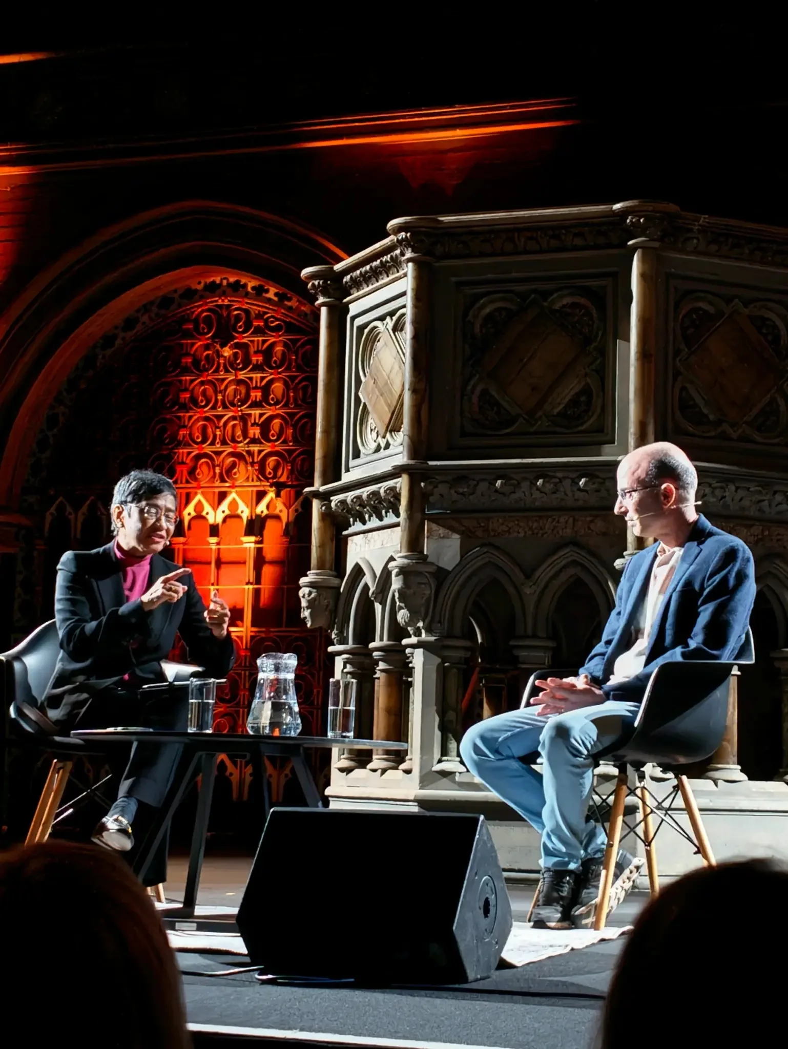 A portrait of the Union Chapel conversation with Maria Ressa and Yuval Noah Harari on stage